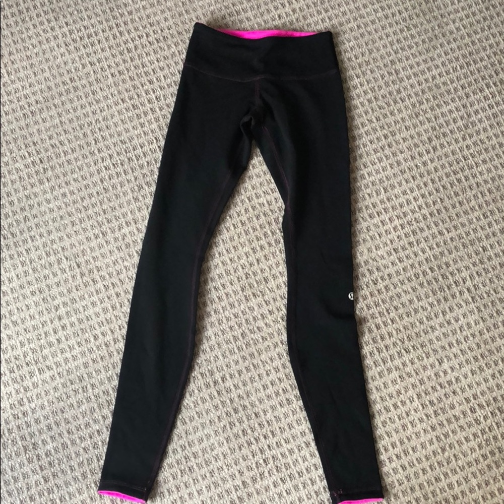 Lululemons reversible black / neon pink leggings